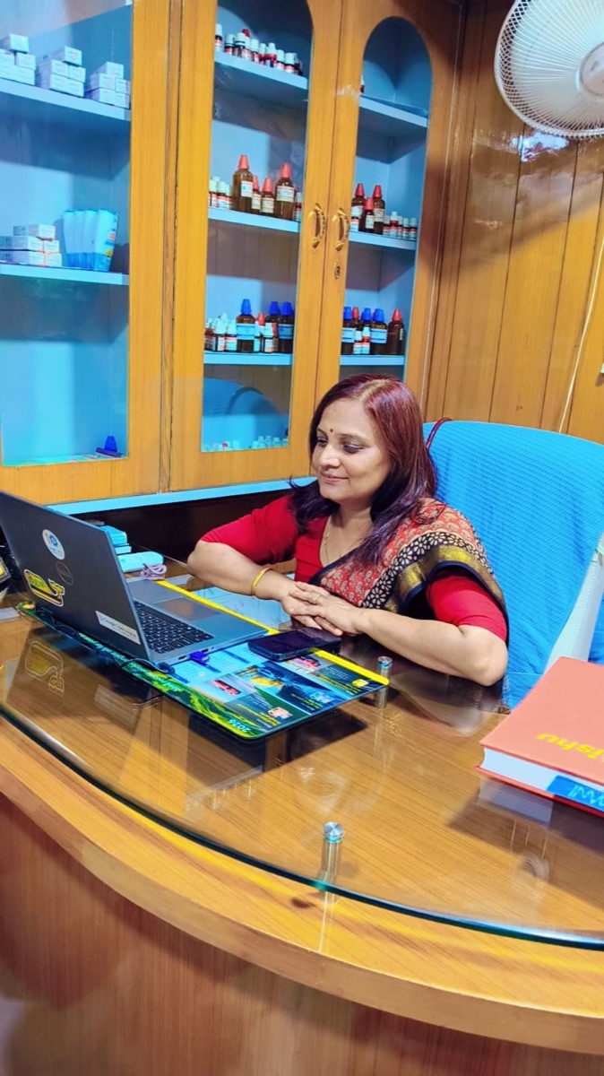 Dr. Geetika Agarwal at her desk at Omni Homoeo Clinic